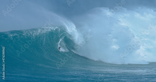 Sport photography. Jaws swell on International surfing event in Maui, Hawai 2021 December.