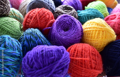 a bunch of balls of colorful woolen thread
