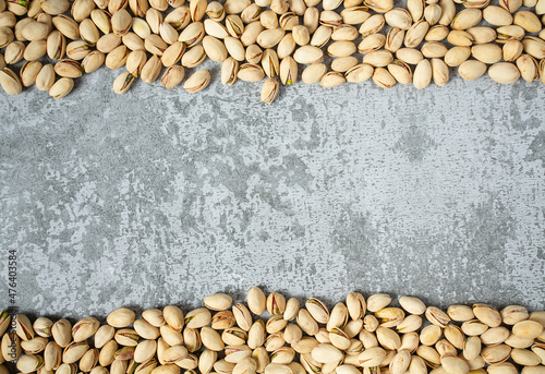 pistachio nuts on stone surface photo