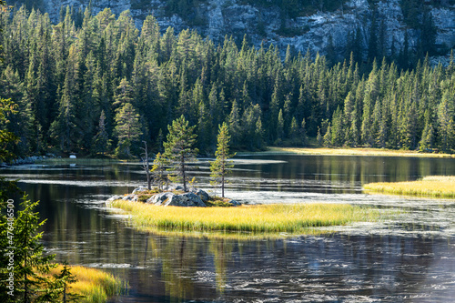 Lake with small Island and pine trees photo