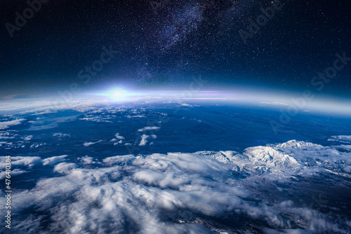 Fototapeta Naklejka Na Ścianę i Meble -  View of stars and milkyway above Earth from space. Beautiful space view of the Earth with cloud formation