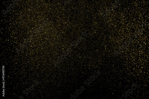 Gold Glitter Texture Isolated on Black Background. Golden stardust. Amber Particles Color. Sparkles Rain. Vector Illustration, Eps 10.