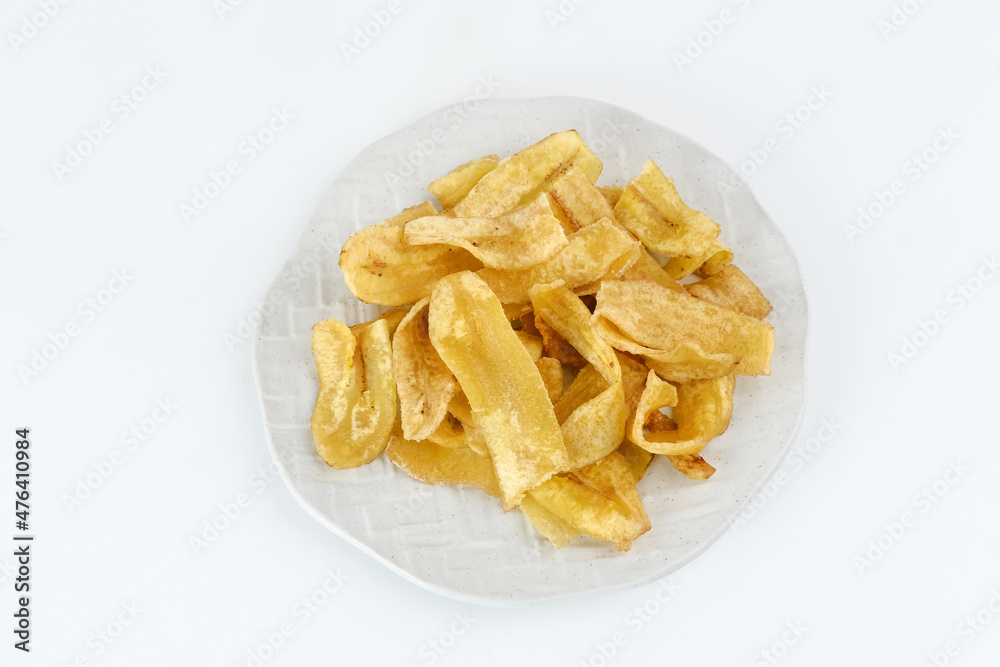 Heap of dried banana chips snack on white background. Selective focus image, blurred background.
Heap of dried banana chips snack on white background. Selective focus image, blurred background.