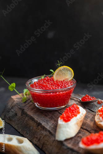 Wallpaper Mural Red caviar on a dark background. Sandwiches with caviar Torontodigital.ca