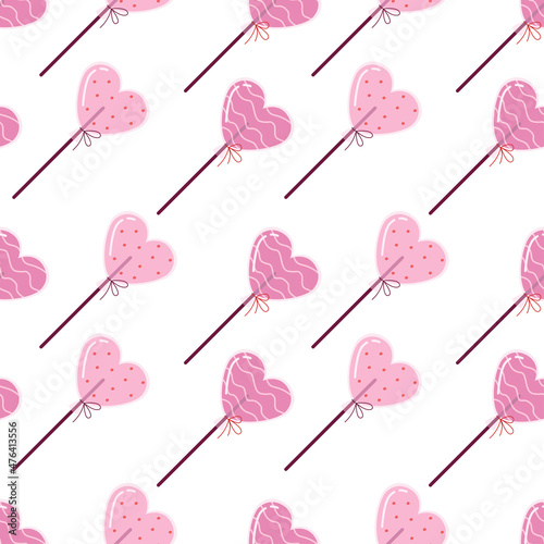 Seamless pattern with heart shaped lollipops on a light background