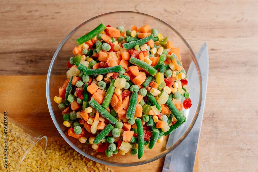 The process of cooking bulgur with vegetables. A dish of Middle Eastern cuisine is bulgur with carrots, string beans and mushrooms. The process of cooking vegetarian food. Bulgur with vegetable mix The process of cooking bulgur with vegetables. A dish of Middle Eastern cuisine is bulgur with carrots, string beans and mushrooms. The process of cooking vegetarian food. Bulgur with vegetable mix