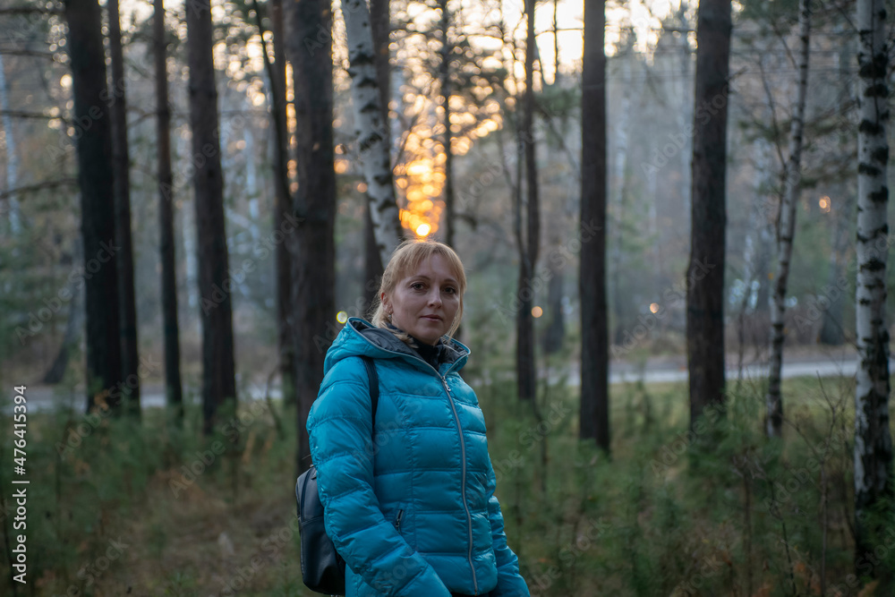 Girl in the autumn forest on the background of the sunset. Girl in the autumn forest on the background of the sunset.
