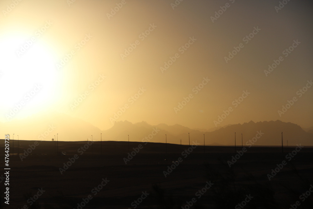 Naklejka premium Winter sunset in Mountain Range of the Arabian Desert