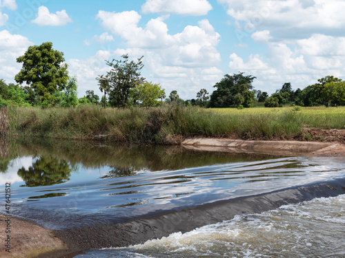 Scenery of flowing streams, rice fields, trees, sky, weirs, nature,landscape, tourism, ecology