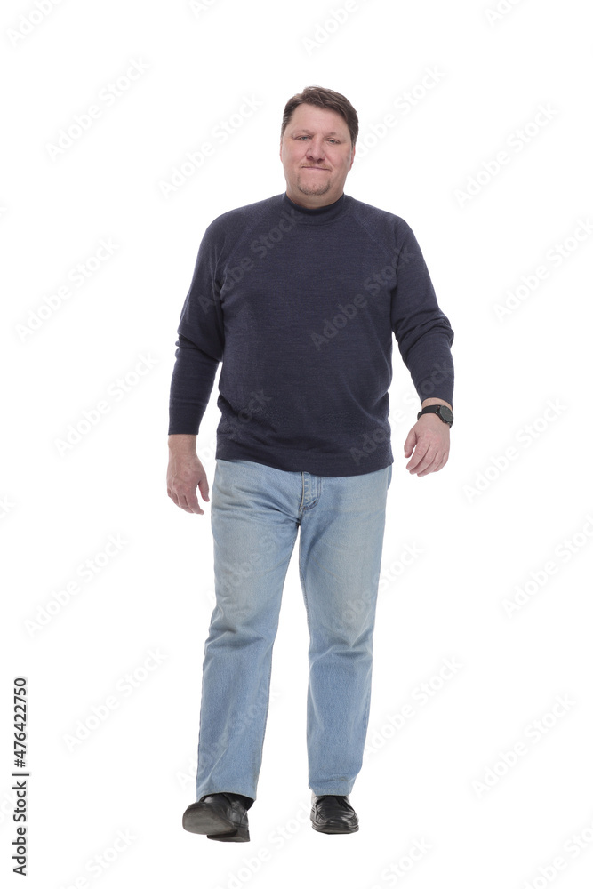 Mature man in jeans striding forward.isolated on a white background. Mature man in jeans striding forward.isolated on a white background.
