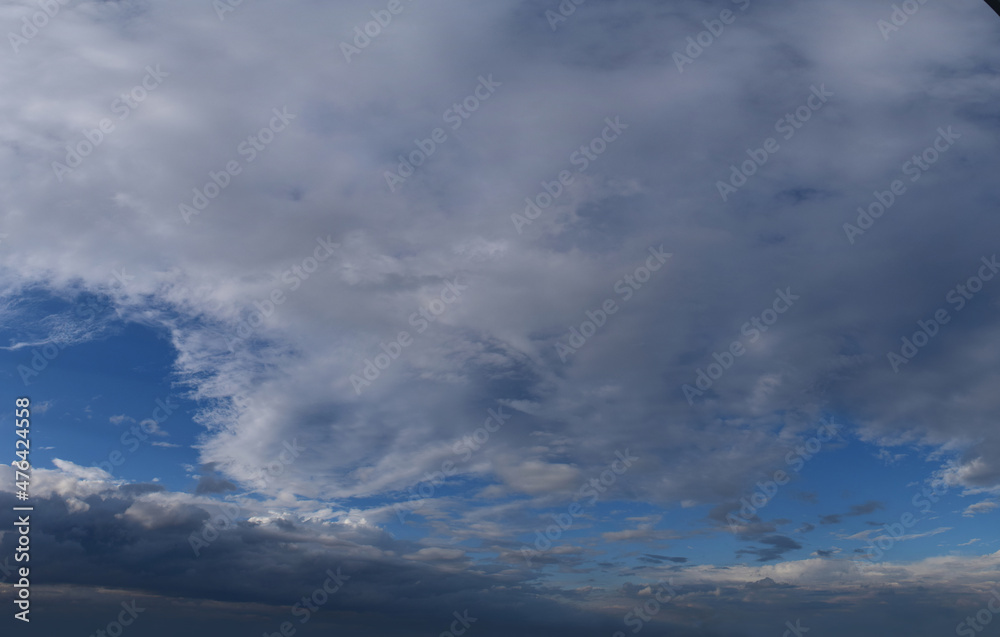 Late evening, impending, powerful thunderclouds.
Panoramic photography, the image is horizontally elongated, atmospheric phenomenon.
