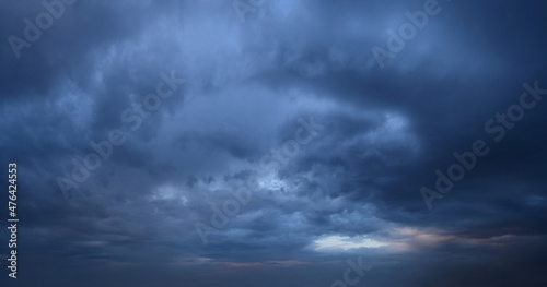 Late evening, impending, powerful thunderclouds. Panoramic photography, the image is horizontally elongated, atmospheric phenomenon. 