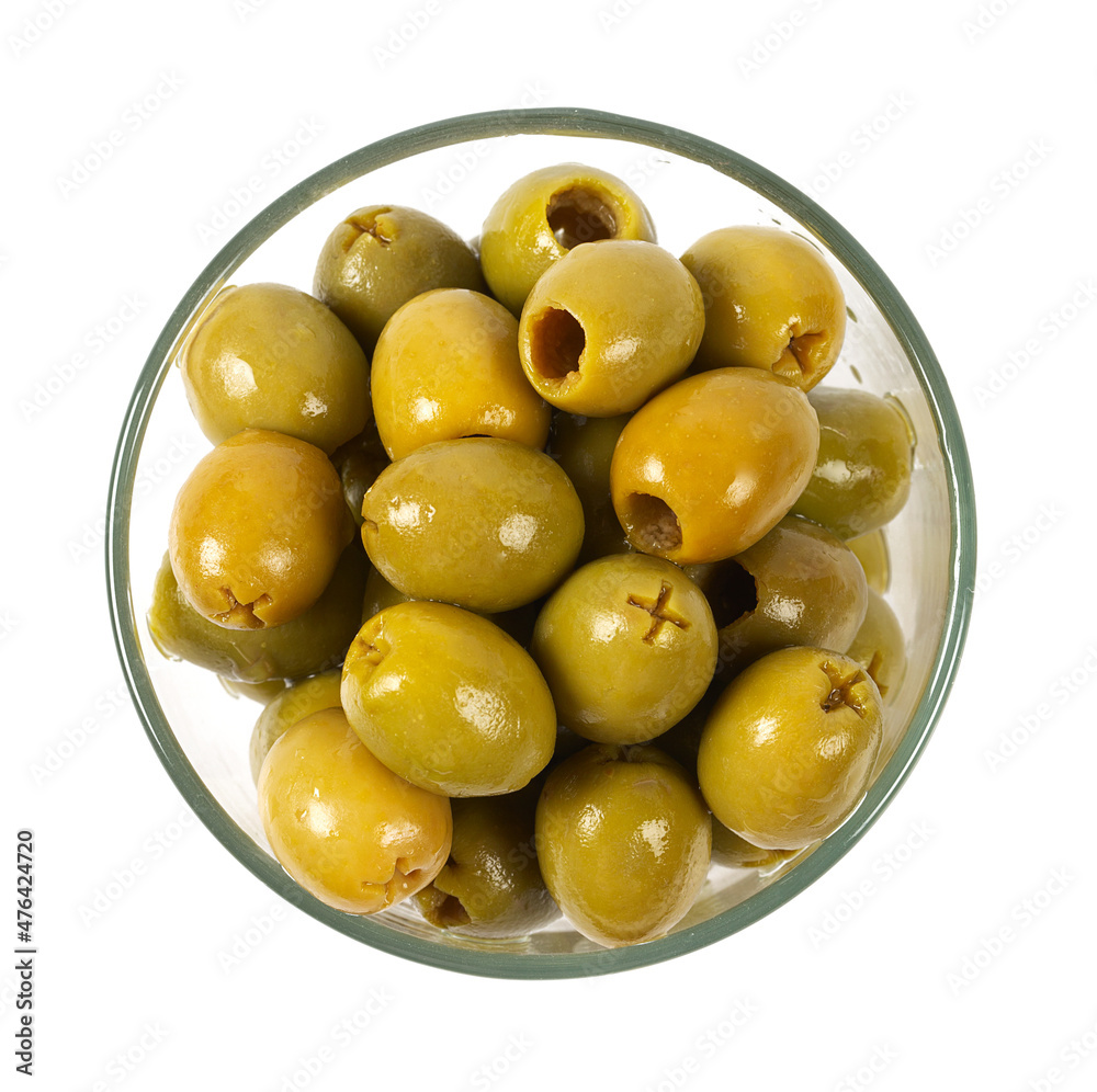 Green olives on a white background. Olives on a white background. Top view. Pitted green olives on white background. Close up. Green olives on a white background. Olives on a white background. Top view. Pitted green olives on white background. Close up.
