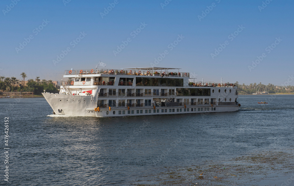 Large egyptian river cruise boat sailing on Nile Large egyptian river cruise boat sailing on Nile