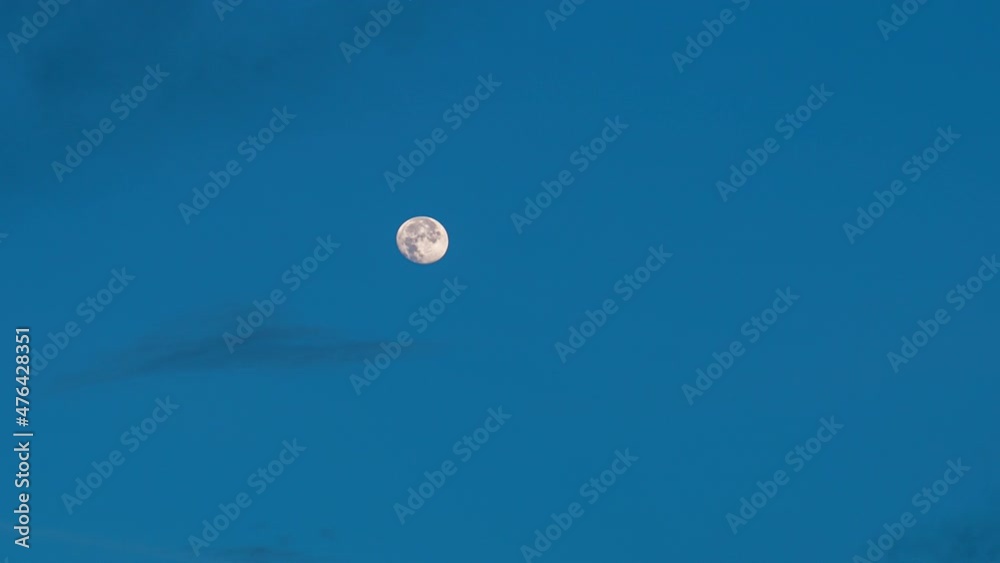 Full moon setting in the blue morning sky. 4K time-lapse Full moon setting in the blue morning sky. 4K time-lapse