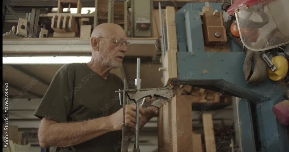 Carpenter fixing his saw Carpenter fixing his saw