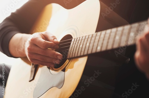 man playing acoustic guitar isolated