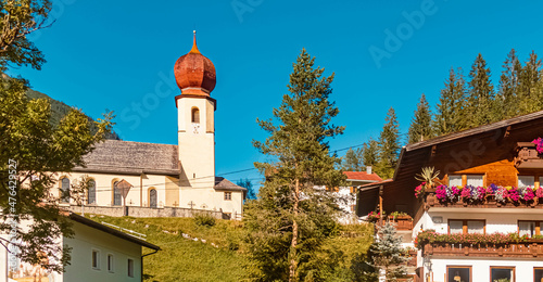 Beautiful church on a sunny summer day at Namlos, Tyrol, Austria photo