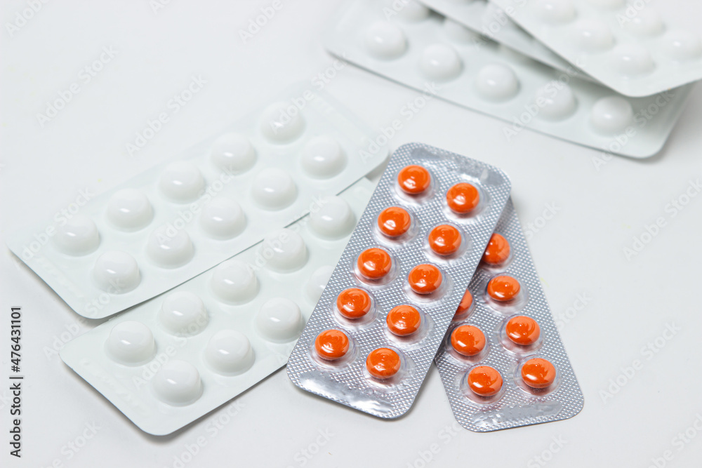 Pills in plates on a white background. Treatment with medication. Health care Pills in plates on a white background. Treatment with medication. Health care