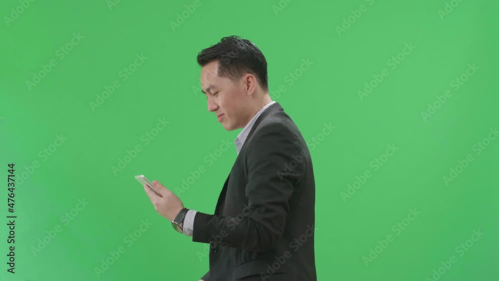 Side View Of Asian Business Man Use Tablet While Walking On Green Screen Chroma Key
Side View Of Asian Business Man Use Tablet While Walking On Green Screen Chroma Key