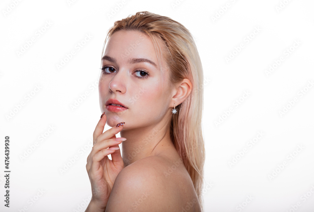 Beauty young woman face wet hair. Portrait of cute blonde female with fresh clean skin looking at camera and touch own face. Isolated on white background. Beautiful, spa and skin care concept. Beauty young woman face wet hair. Portrait of cute blonde female with fresh clean skin looking at camera and touch own face. Isolated on white background. Beautiful, spa and skin care concept.