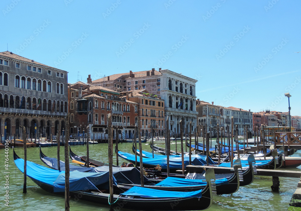 Venice, Italy, July 2017 - view of some gondolas harbored at the Grand Canal 