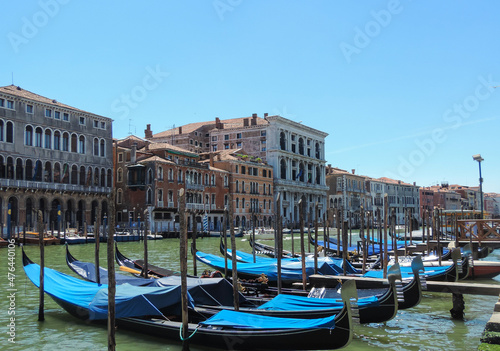 Venice, Italy, July 2017 - view of some gondolas harbored at the Grand Canal  © Bernard Barroso