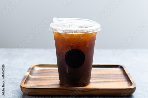 Iced americano in plastic cup.