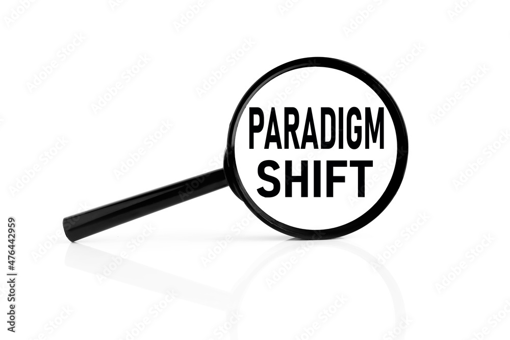 paradigm shift. text inside the magnifier. magnifying glass on white background paradigm shift. text inside the magnifier. magnifying glass on white background