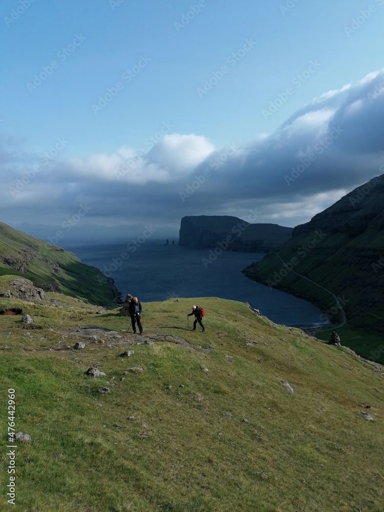 A group of hikers in the hills and mountains of the Faroe Islands