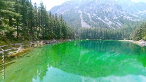 Grüner See Styria, Tragöss, Austria FPV drone arial with mountain view and green water