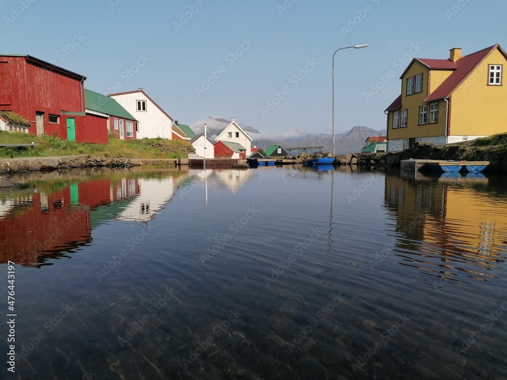 Fototapeta premium The cute and cozy old historical houses of the Faroe Islands with grass on the roof
