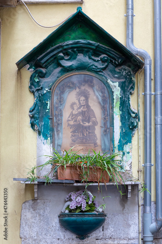 Characteristic house shrine with saints and madonna with child in Naples, Italy. photo