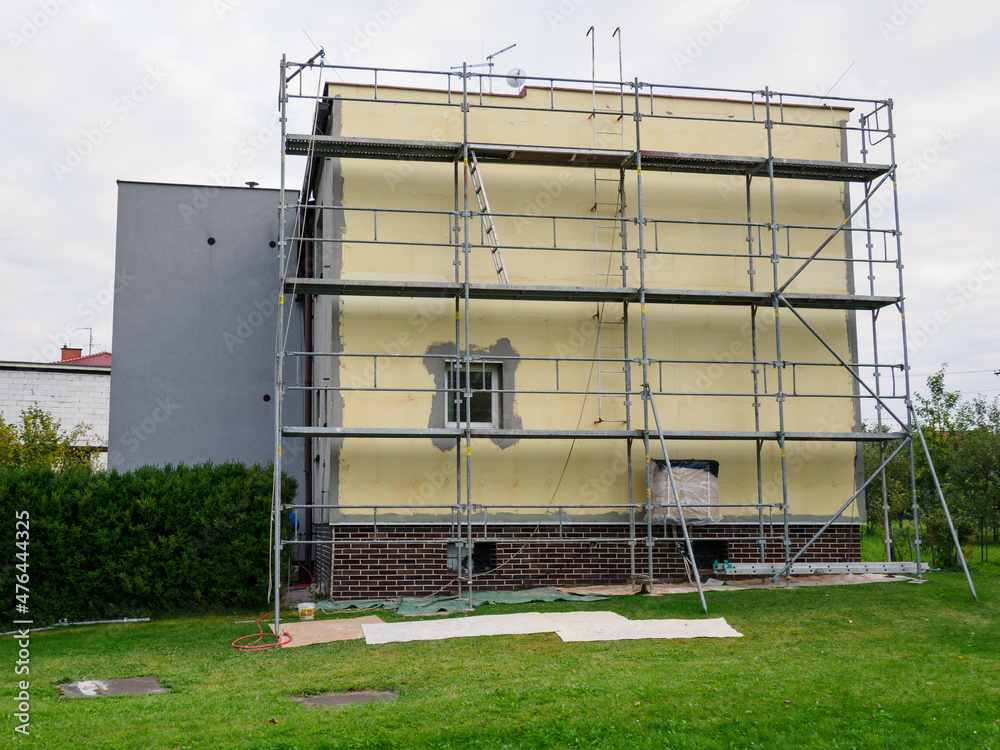 Scaffolding on the outside of a family house.