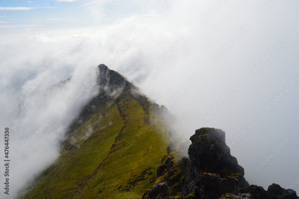 The view from the green mountains over the Faroe Islands and the Atlantic Sea