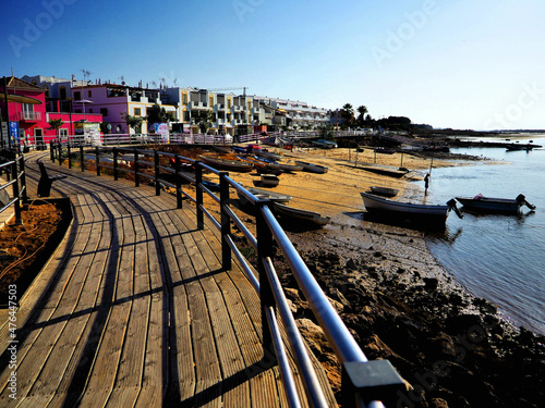 Picturesque boardwalk on the waterfront at holiday resort destination.
