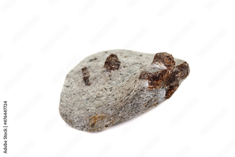 macro mineral stone Staurolite on a white background macro mineral stone Staurolite on a white background