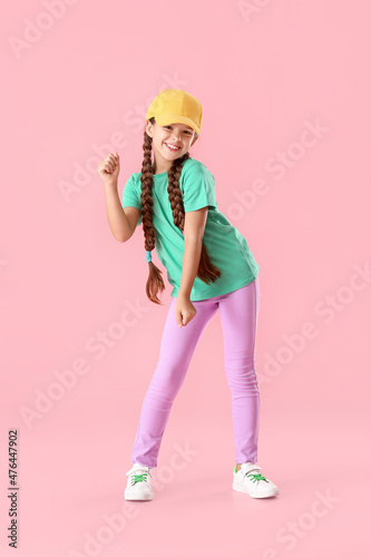 Cute little girl in cap dan...