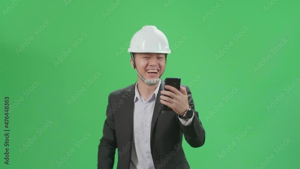 Asian Chief Engineer In The Hard Hat Having Video Call On Mobile Phone While Walking On Green Screen Chroma Key
Asian Chief Engineer In The Hard Hat Having Video Call On Mobile Phone While Walking On Green Screen Chroma Key