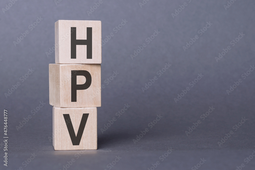 HPV - text, written on wooden blocks, on gray background. HPV - text, written on wooden blocks, on gray background.