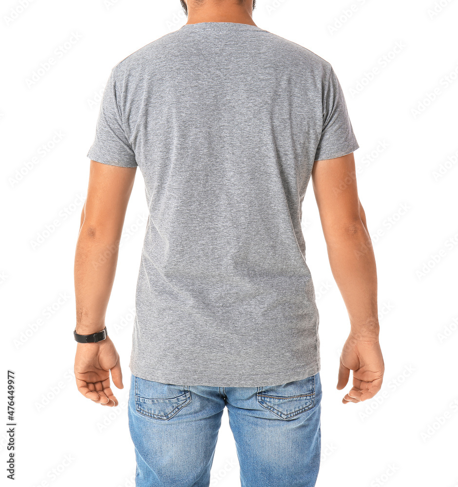 Handsome man in grey t-shirt on white background Handsome man in grey t-shirt on white background