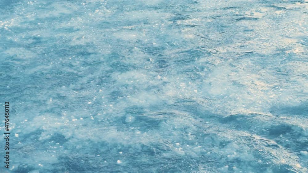 Frozen river with a huge current, Fragments of ice floating down the river, Crystal clear water and ice, a melting glacial river in Iceland Frozen river with a huge current, Fragments of ice floating down the river, Crystal clear water and ice, a melting glacial river in Iceland