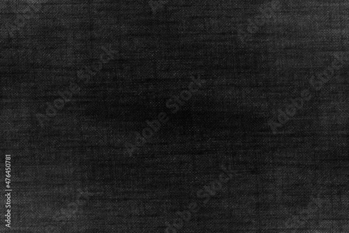 Abstract dark texture background of desaturated denim fabric