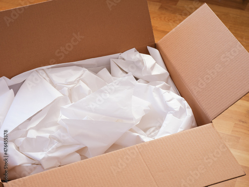 Crumpled paper in a cardboard box