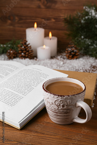 Cup of tasty coffee, book a...