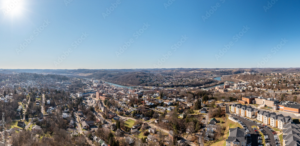 Aerial drone panoramic shot of the downtown area of Morgantown with the WVU campus in the early winter