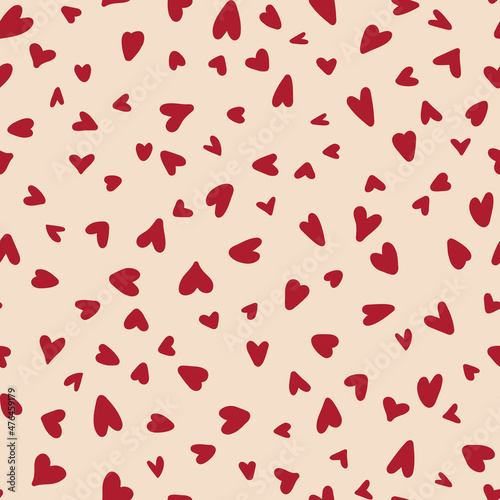 Hand drawn hearts seamless repeat pattern. Random placed, vector love sing elements all over surface print on beige background.