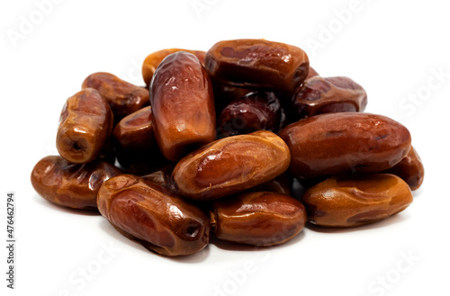 Dates close-up on a white background. Isolate of a bunch of dates. Dried fruits
