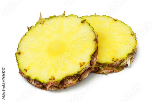 Ripe juicy round pineapple slices isolated on white background. Fresh fruits.