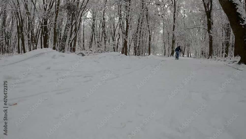Amateur enduro rider on the bicycle in the winter season Amateur enduro rider on the bicycle in the winter season